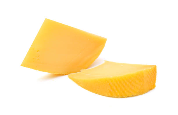 istock sliced of cheddar cheese isolated on white 1254074337