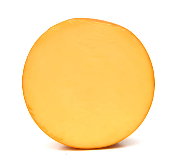 cheddar cheese isolated on white - cheese wheel cheese cheddar wheel imagens e fotografias de stock