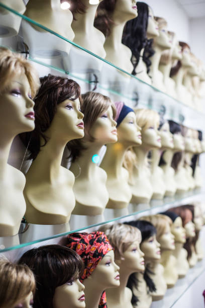istock Rows of hair wigs 1254077546