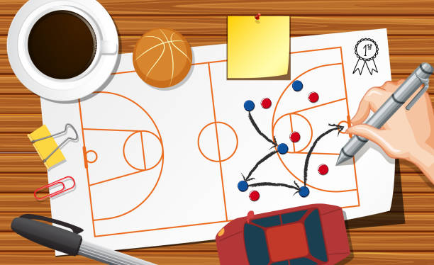 istock Close up hand writing basketball plane on paper with coffee cup on desk background 1254077740