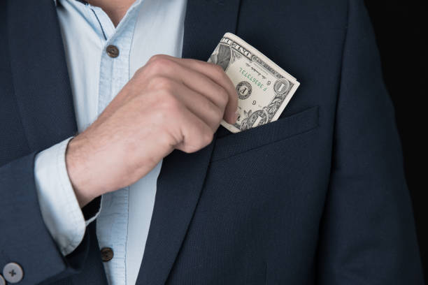 istock man hand money on pocket 1254080146