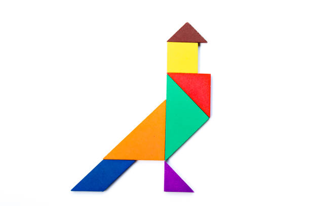 istock Color wood tangram puzzle in bird shape on white background 1254082086