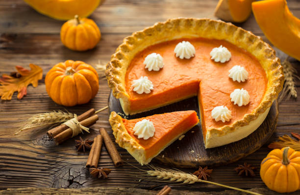 istock Fresh homemade pumpkin pie on the wooden table 1254083387