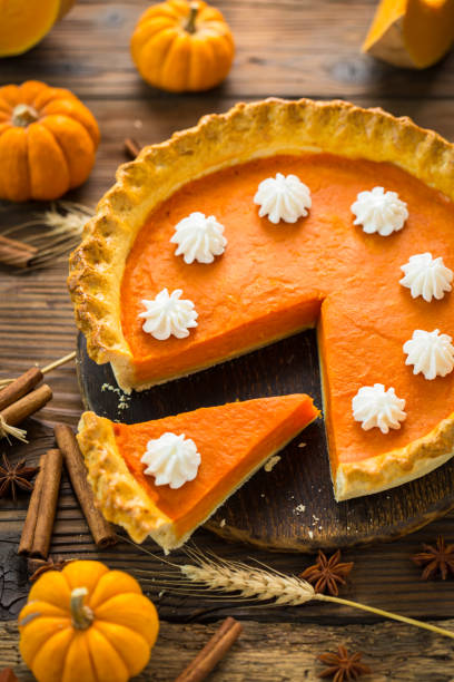istock Fresh homemade pumpkin pie on the wooden table 1254083389
