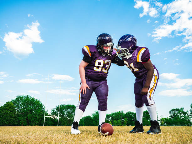 istock Junior Football players during game 1254083622