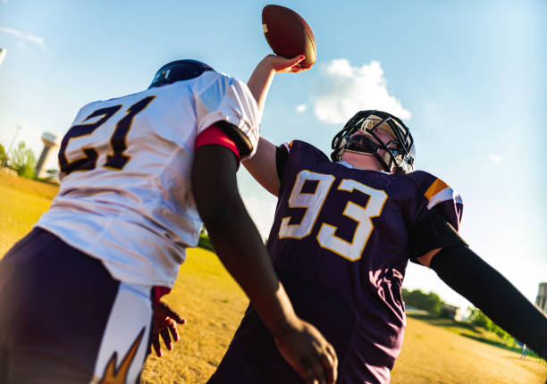 istock Junior Football players during game 1254084028