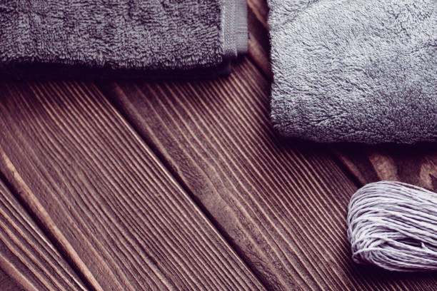 istock Blue bath towels on wooden background texture 1254084796