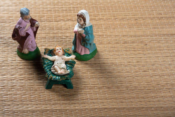 christmas nativity scene with old and weather-worn pieces, selective focus.