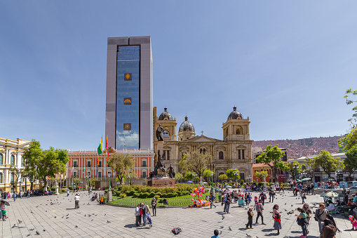 La Paz, Bolivia - september 30, 2018: People walks in Plaza Murillo, with the Presidential Palace and the Cathedral in La Paz, Bolivia
