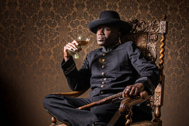 Handsome traditional dutch black man wearing historically correct outfit holding a gun in a typical townhouse drawing room