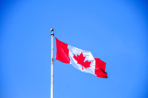 istock Canadian maple leaf flag landscape 1254097249