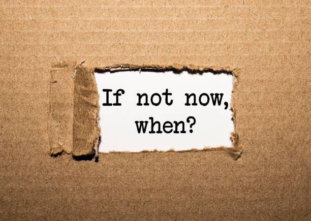 istock The text IF NOT NOW, WHEN. behind torn brown paper 1254097495