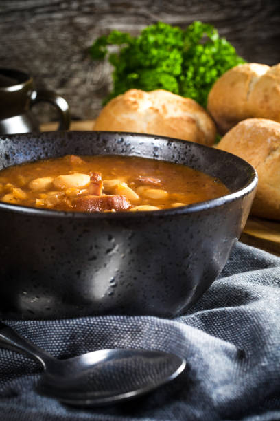 istock Beans with tomato sauce, bacon and sausage. 1254098038