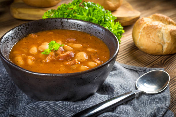 istock Beans with tomato sauce, bacon and sausage. 1254098118