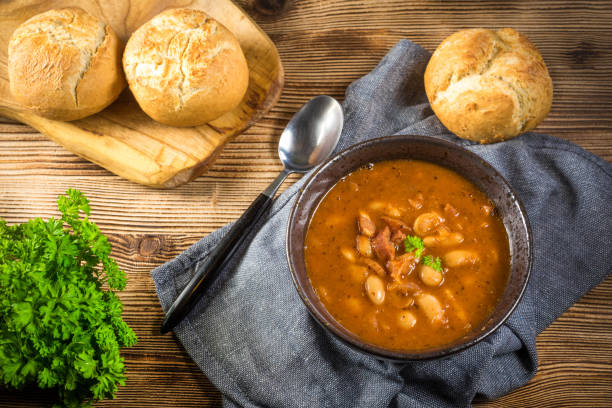 istock Beans with tomato sauce, bacon and sausage. 1254098161