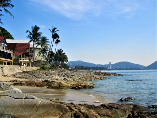 istock Sea, palm trees and mountains in Thailand 1254101597