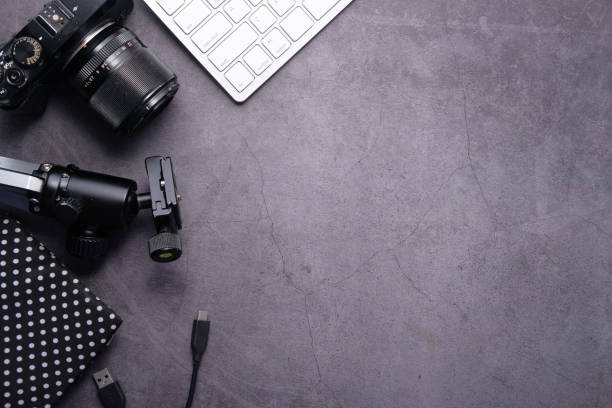 istock Flat lay camera and equipment on working desk 1254104626