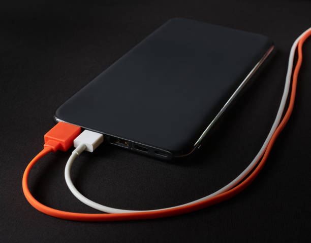 istock External battery for recharging, power bank on a black background 1254105010