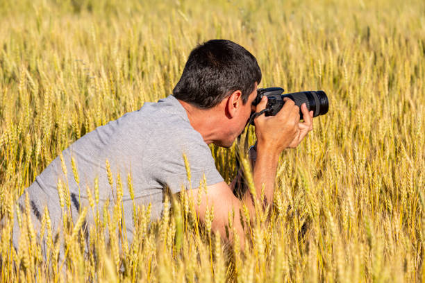 istock Photographer at Wheat Field 1254116517