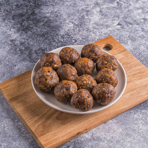 istock Fruit and nut energy balls in a plate, top view 1254117166