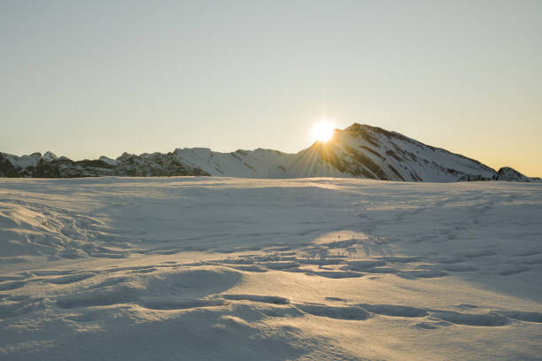 Sunset behind the Schwalmis peak above the Lake Luzerne in Switzerland