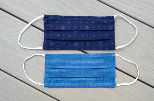 istock Dark and Light Blue Cloth Face Masks With Diamond and Striped Designs 1254119484