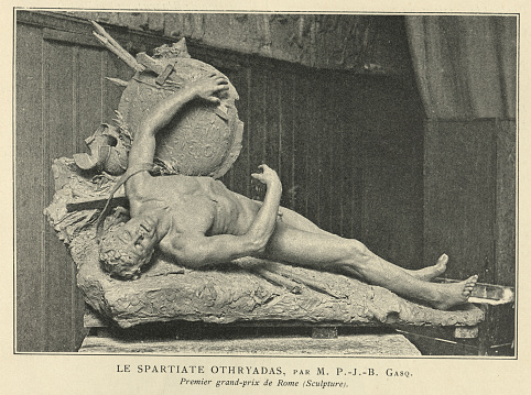 Vintage photograph of the statue Le Spartiate Othryadas (The Spartan othryadas). Othryades was the last surviving Spartan of the 300 Spartans selected to fight against 300 Argives in the Battle of the 300 Champions. Ashamed by surviving his comrades, he committed suicide on the field following the battle.