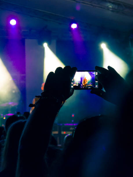 istock Concert hall with people silhouettes 1254121856