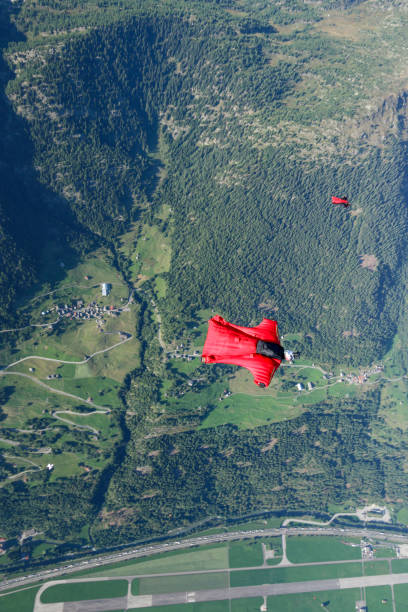 istock Wing suit fliers soar over Swiss Alps 1254123094
