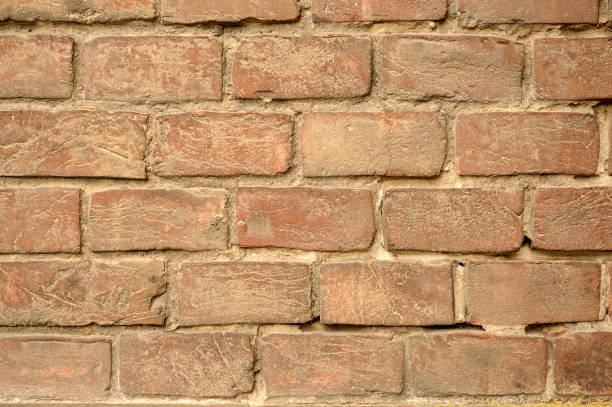 istock Fragment of an old red brick wall. 1254123183