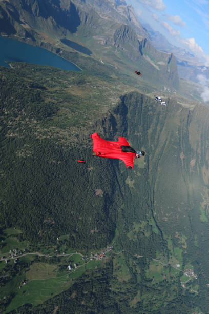 istock Wing suit fliers soar over Swiss Alps 1254123754