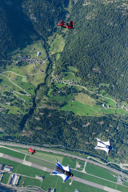 istock Wing suit fliers soar over Swiss Alps 1254124025