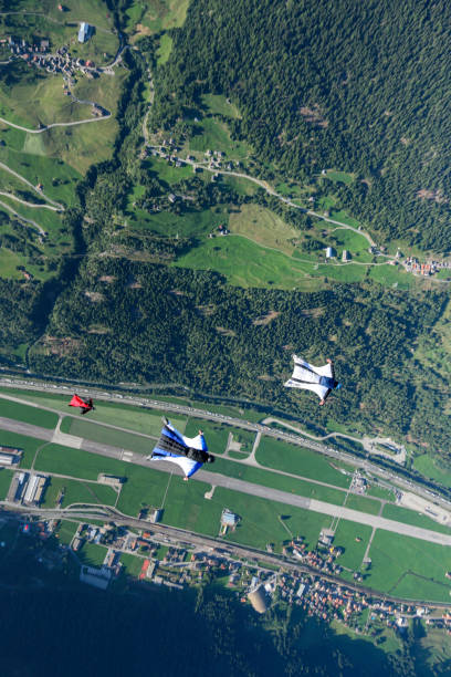 Wing suit fliers soar over Swiss Alps