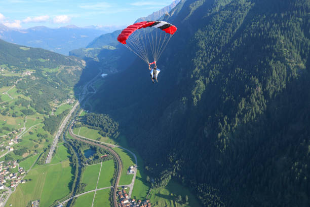 istock Paraglider soars over Swiss Alps 1254124939