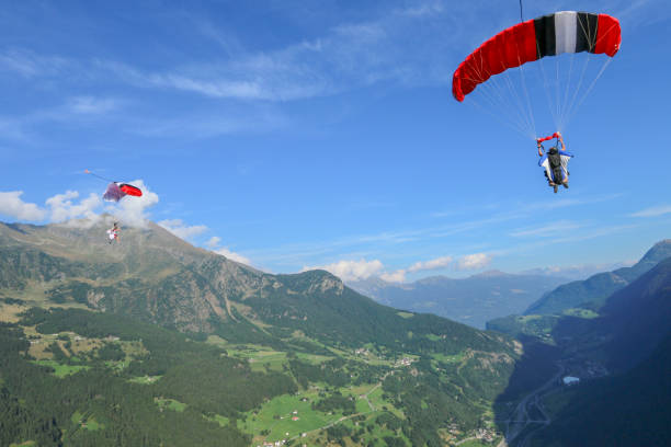 istock Paragliders soar over Swiss Alps 1254124950