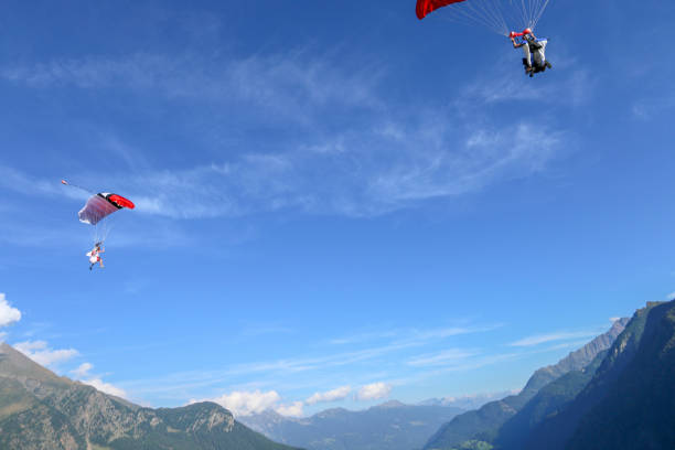 istock Paragliders soar over Swiss Alps 1254124951