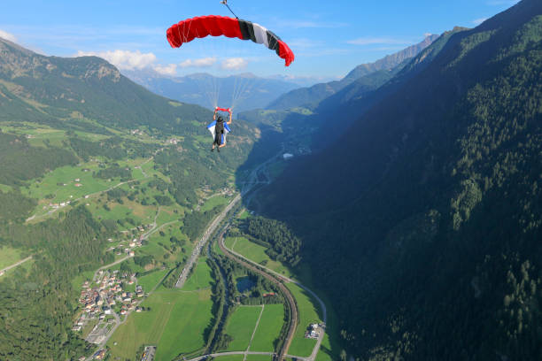 istock Paraglider soars over Swiss Alps 1254125264