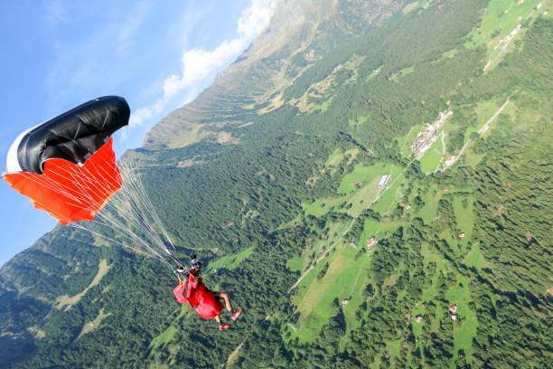 istock Paraglider soars over Swiss Alps 1254125274