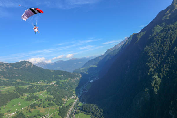 istock Paraglider soars over Swiss Alps 1254125320