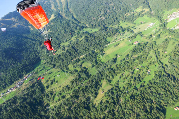istock Paraglider soars over Swiss Alps 1254126065