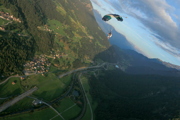 istock Paraglider soars over Swiss Alps 1254126235