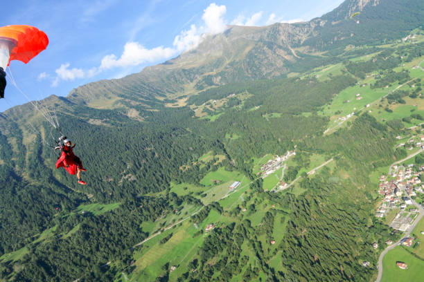 istock Paraglider soars over Swiss Alps 1254126254
