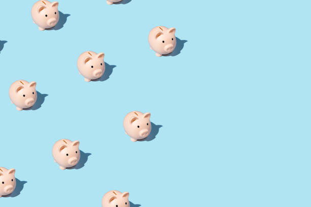 istock piggy bank izometric pattern on bright light blue background. Minimal flat lay texture. Abstract trendy fresh concept 1254126324