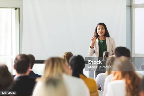 Businesswoman Holding A Speech Stock Photo - Download Image Now - Education Training Class, Presentation - Speech, Lecture Hall