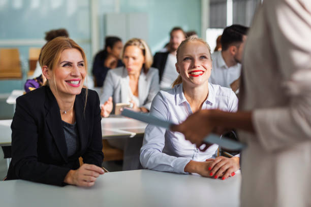 istock Businesswomen talking with the presenter 1254127459