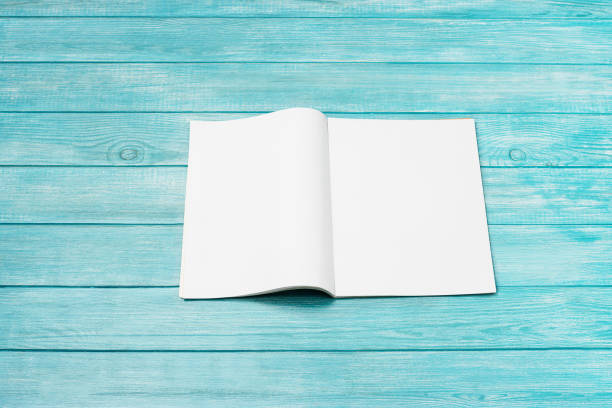 istock Mock-up magazine, newspaper or catalog on blue background. Blank page 1254128305