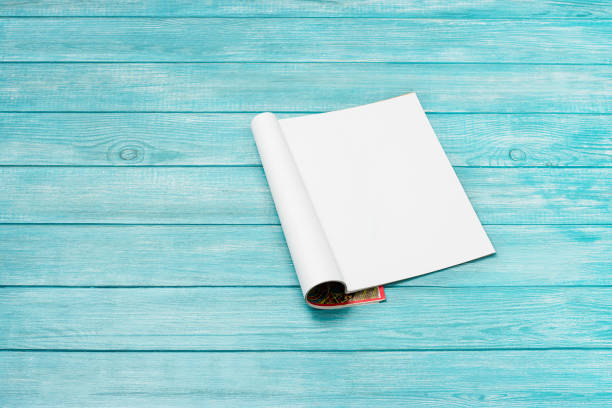 istock Mock-up magazine, newspaper or catalog on blue background. Blank page 1254128317