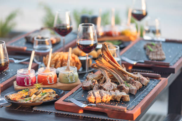 Steak House outdoor table with variety meat dishes - Hotel Luxury Restaurant
