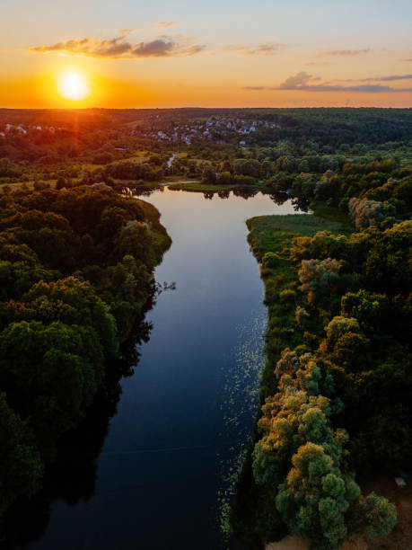 istock Sunset above the river in natural rural landscape 1254133011