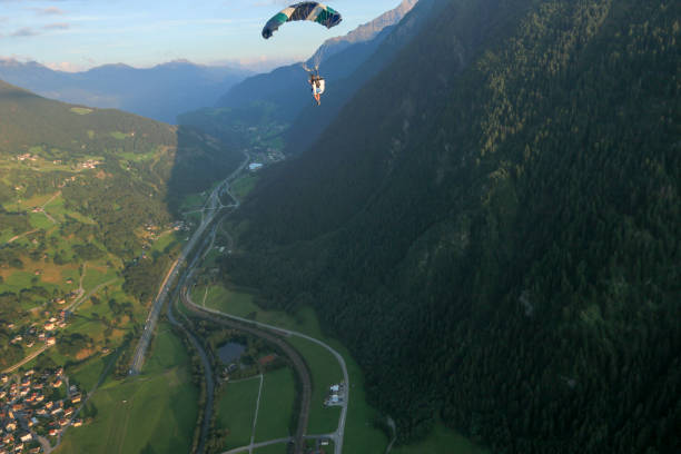 istock Paraglider soars over Swiss Alps 1254133885